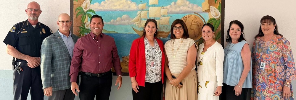 Admin group visiting KWHS to see CTE Class