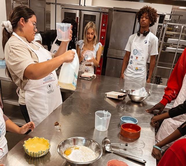 Students making cake pans
