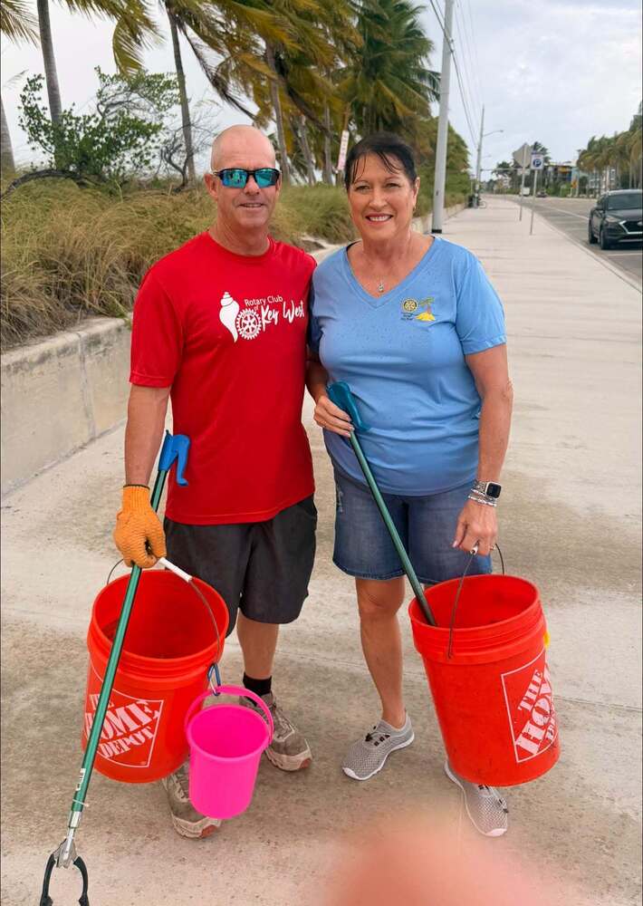 Superintendent and Deputy Superintendent cleaning up the beach