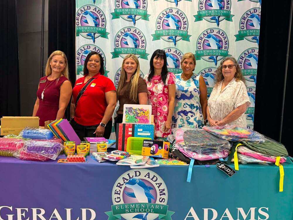 Zonta group with donated school supplies