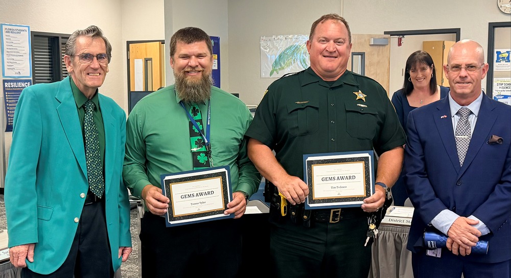 Trevor Tyler and Tim Tedesco are honored for saving lives from a fire