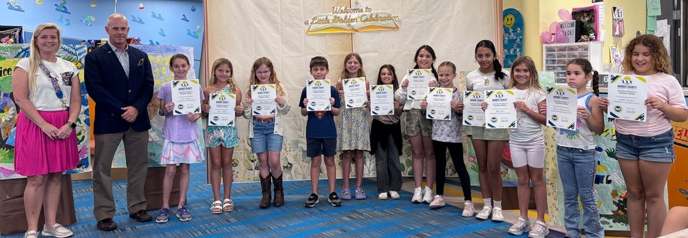 Superintendent with young readers