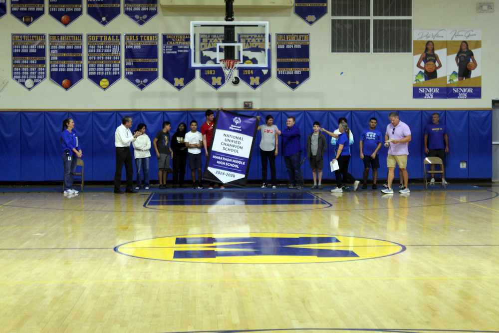 students holding banner