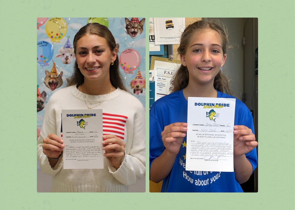 students holding up their awards