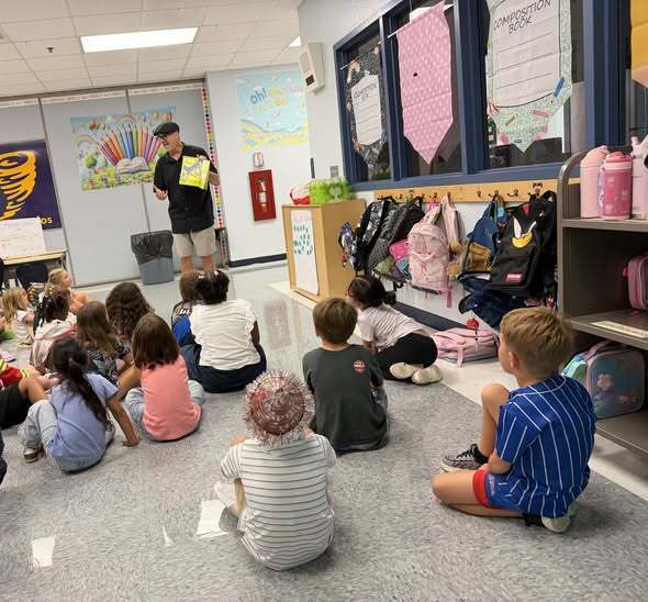 Mr. Pais reading to 1st grade