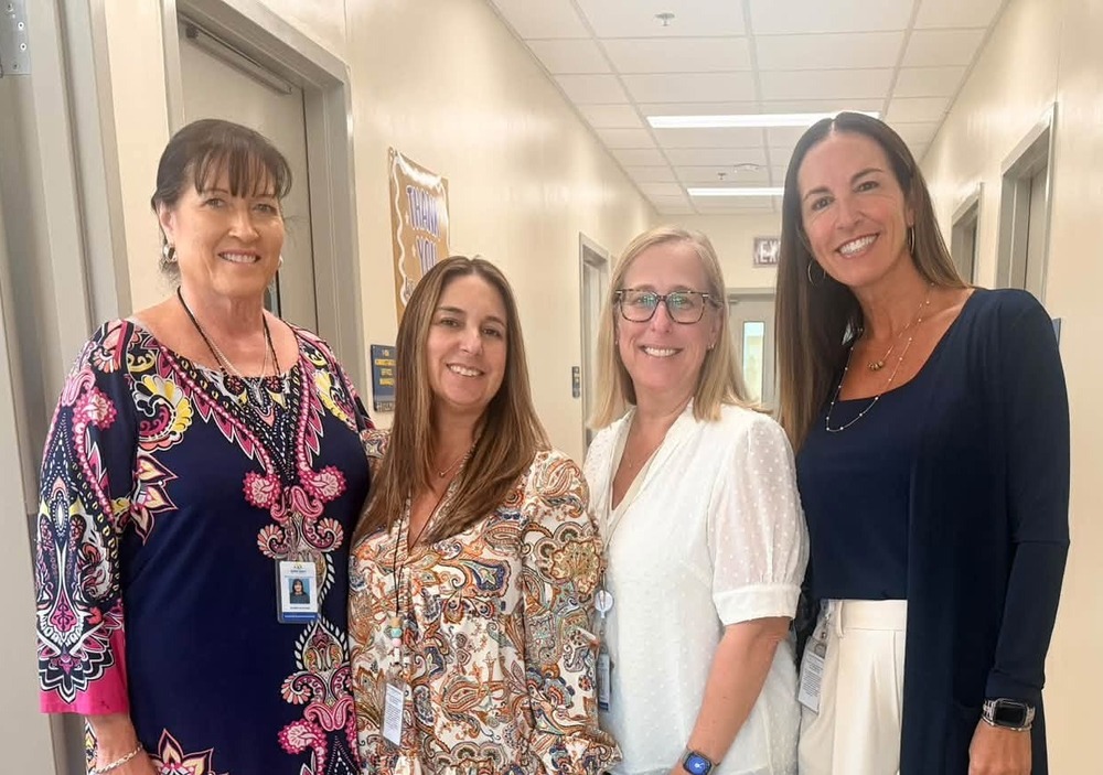 Deputy Superintendent Acevedo with staff at PK School