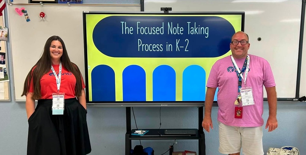 Teachers speaking at district gathering
