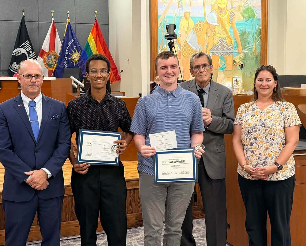 Superintendent, School Board Chair and KWHS Principal with two students who excellent academically