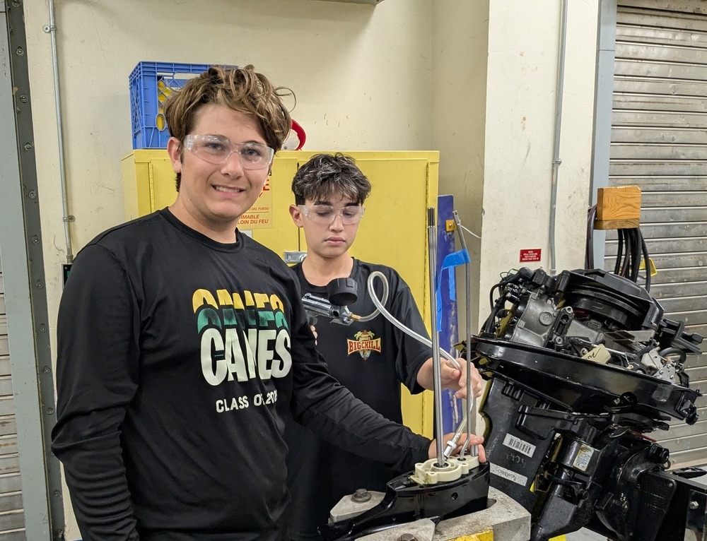 CTE Students learn how to work on outboard engines