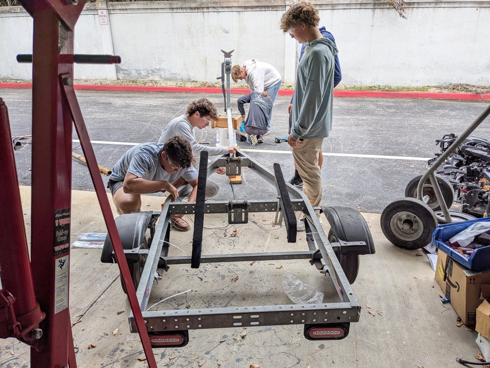 Students wiring a boat trailer