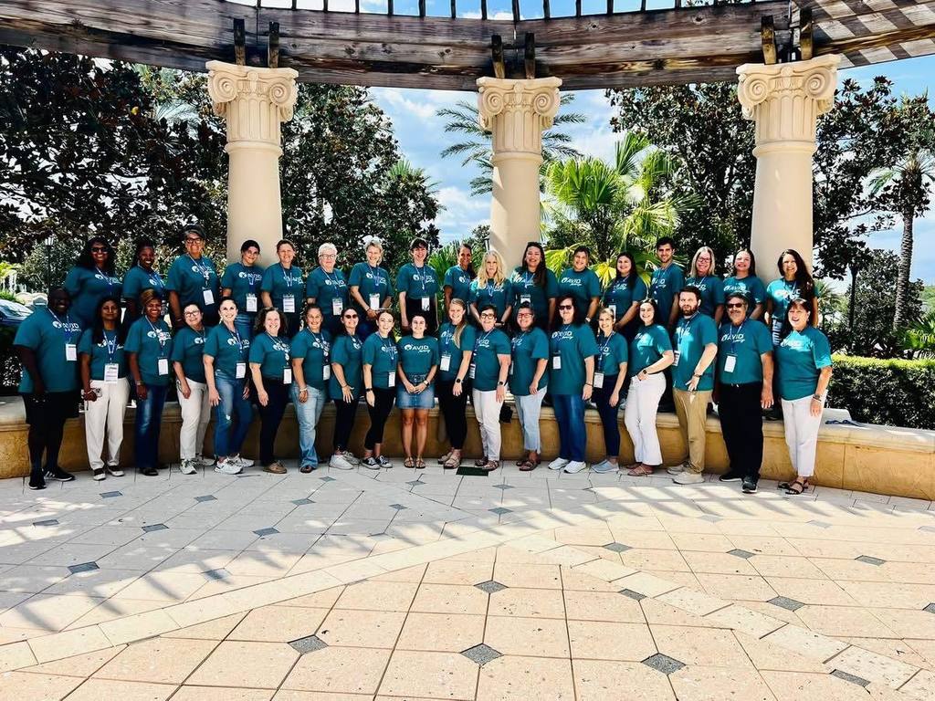 group of adults standing for a group photo