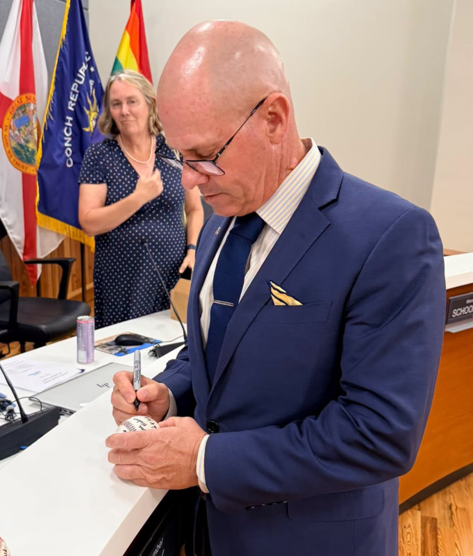 signing a baseball