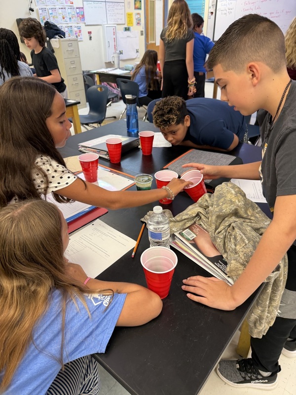 students doing science experiment