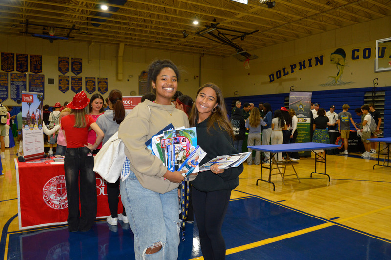 students with college pamphlets