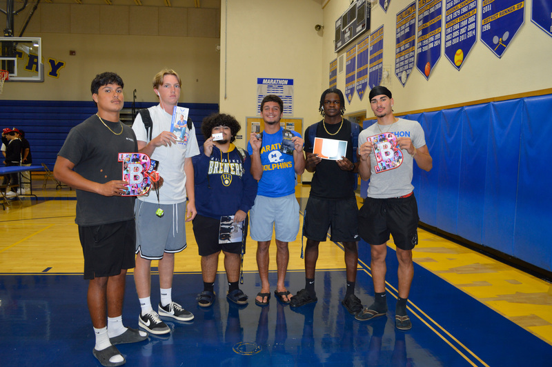 students with college pamphlets