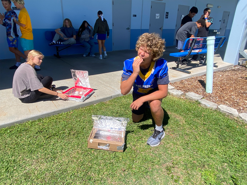 student eating  a s'more