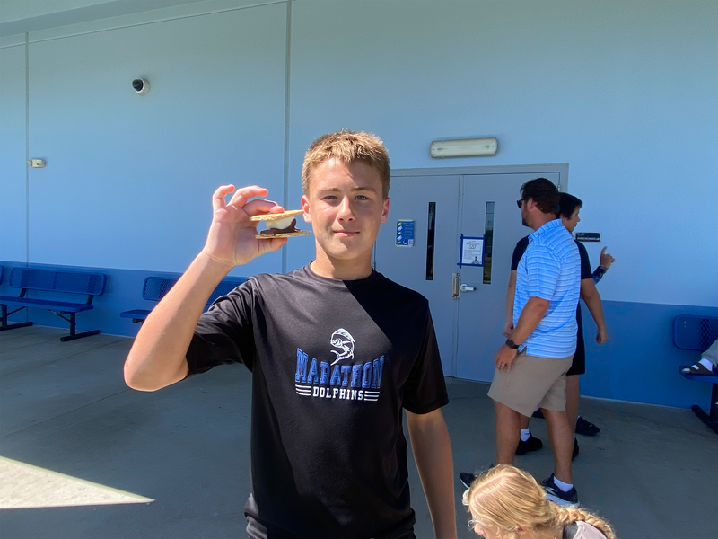 student eating s'more