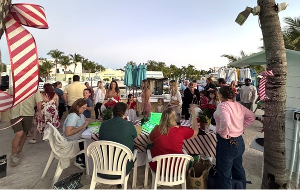 people entering the fish fry at welcome table
