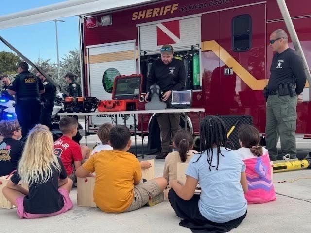Fire rescue divers speaking to students 