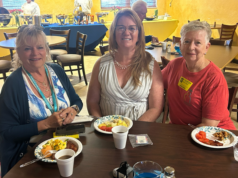 volunteers with breakfast