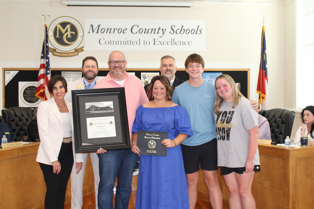 Drew and Kim Winters with MCBOE admin and their family