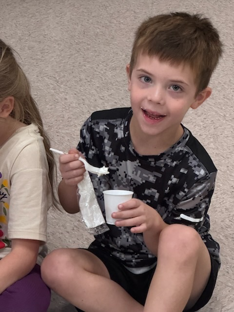 kinder student enjoying pumpkin pie