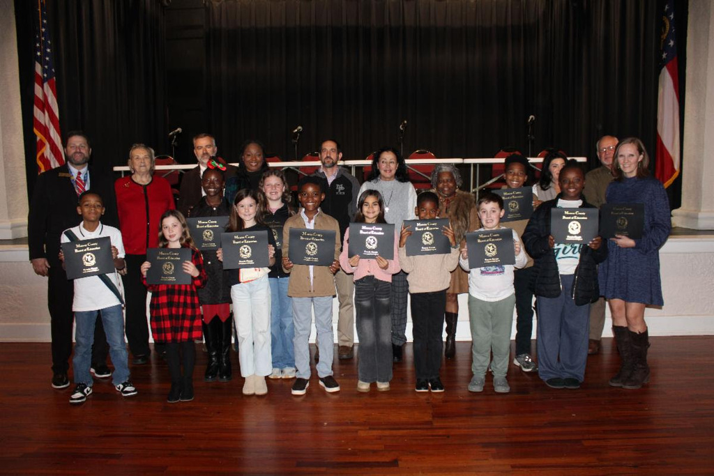 Club Tome team with advisor and Board of Education members. 