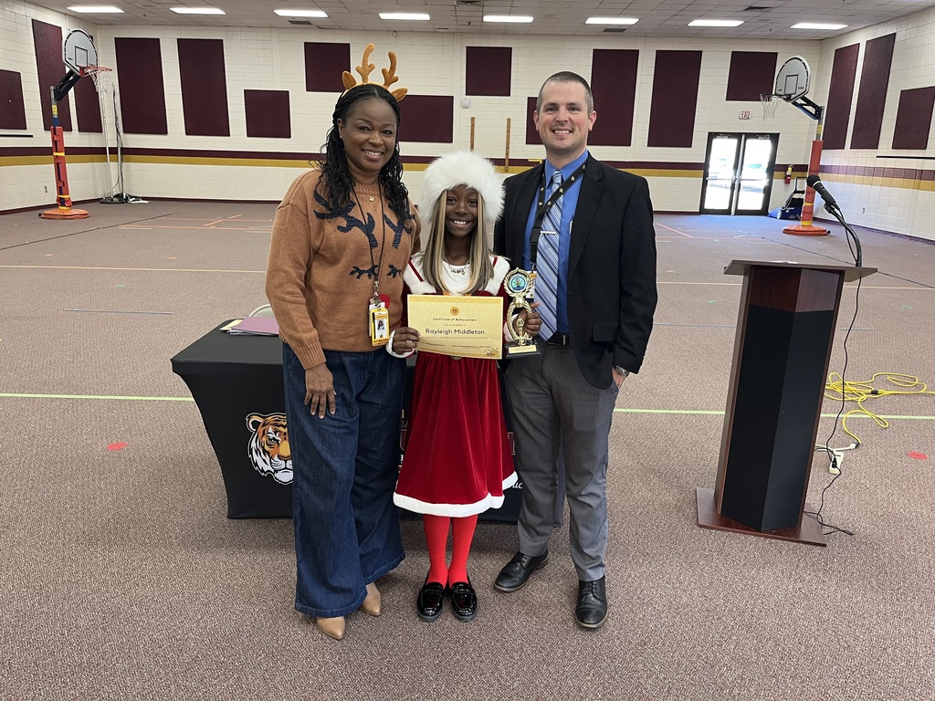 Hubbard's spelling bee champion Rayleigh Middleton with administrators