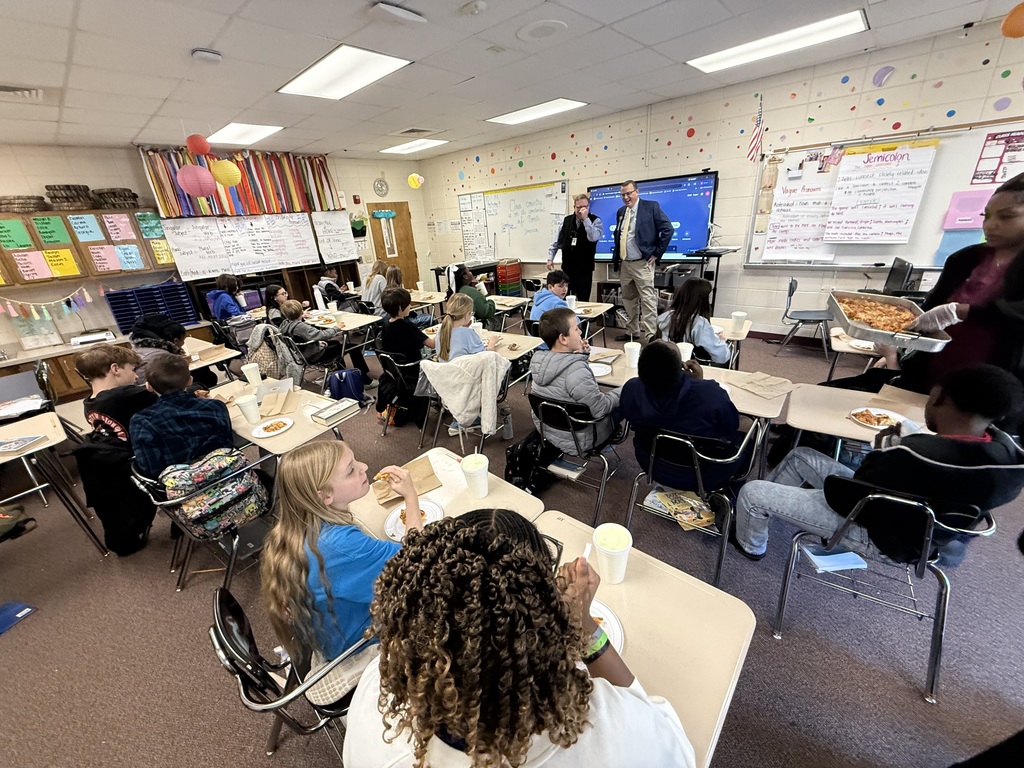 Mr. Flanders and Mr. Durham visit Mrs. Etheridge's 5th grade class. 