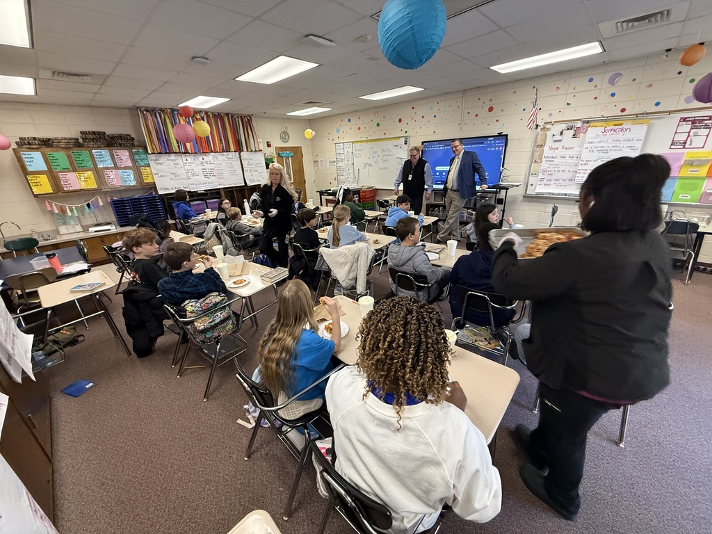 Mr. Flanders and Mr. Durham visit Mrs. Etheridge's 5th grade class. 