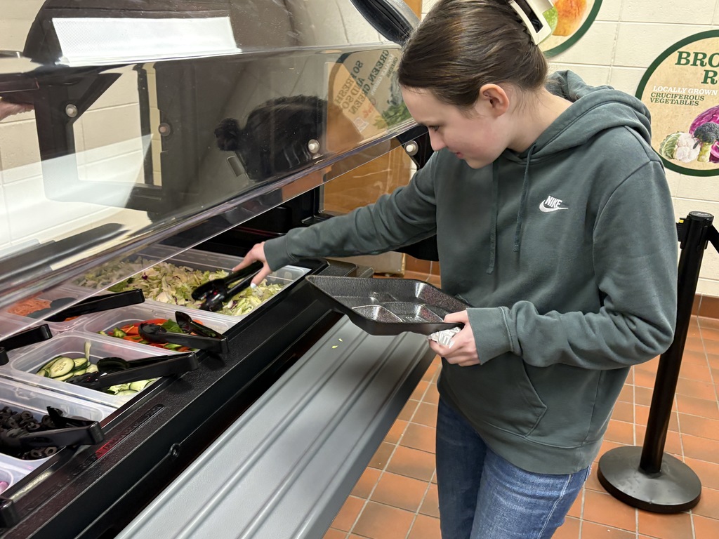 student making a salad