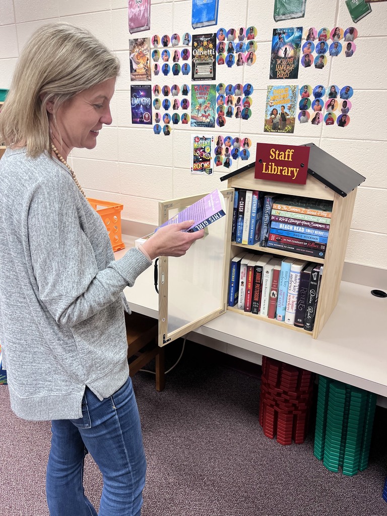 Mrs. Price looking at the staff library