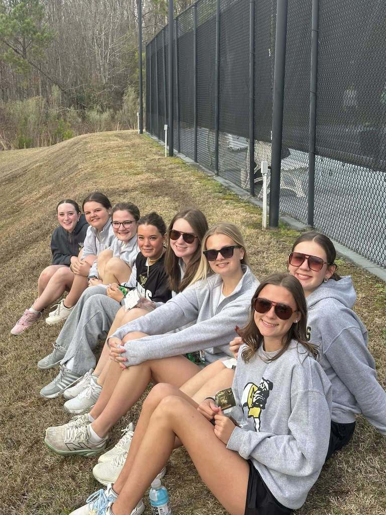 MP Tennis ladies cheering on their team.