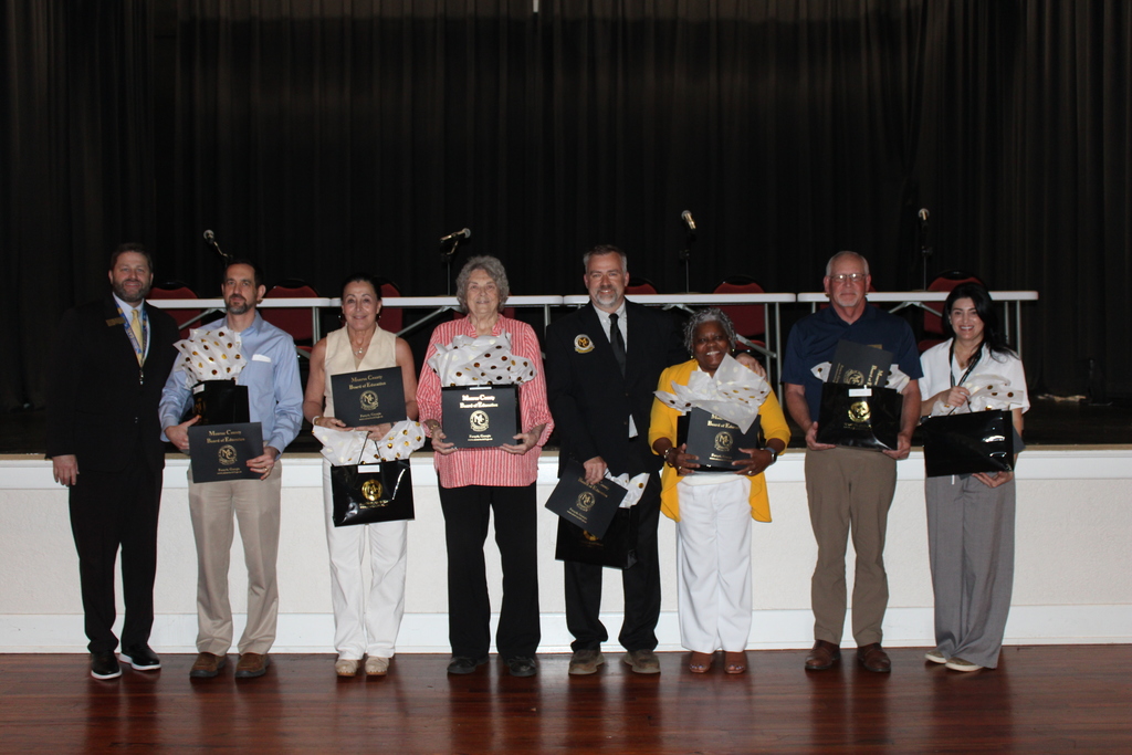 board members holding gifts