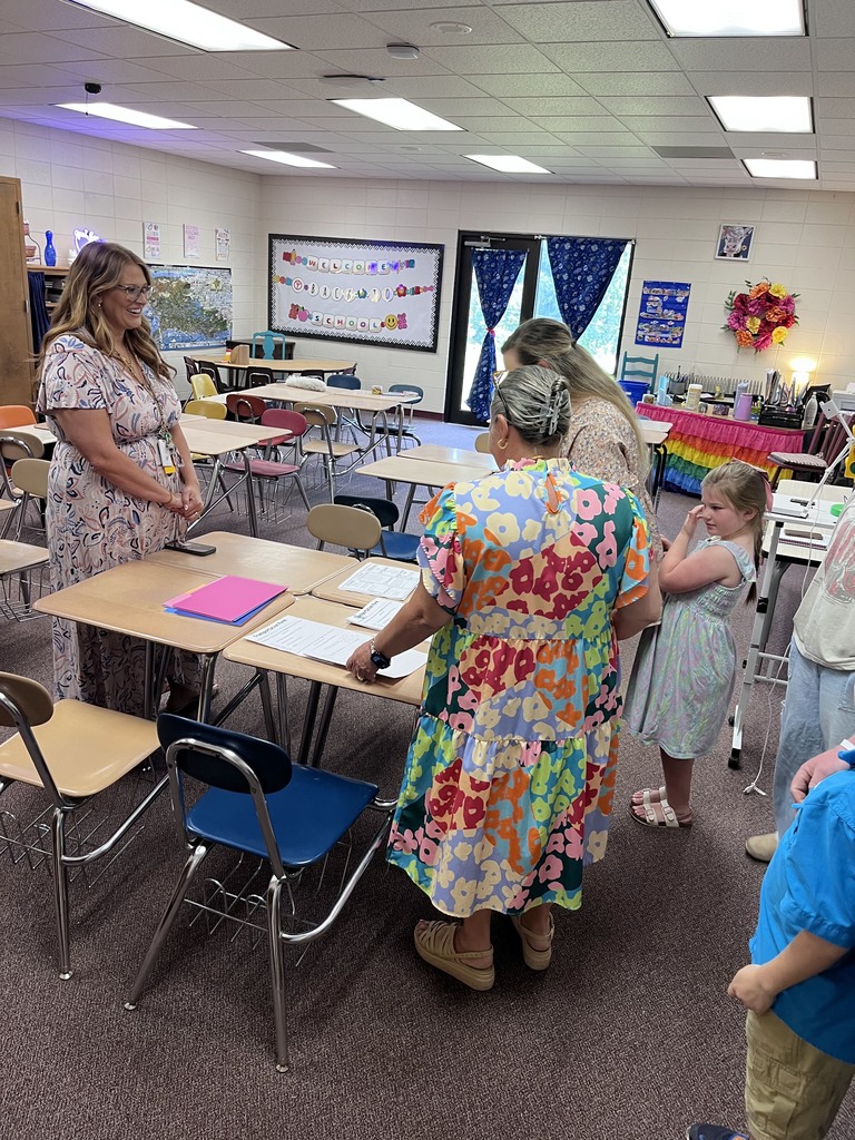Teacher meeting parent at Open House