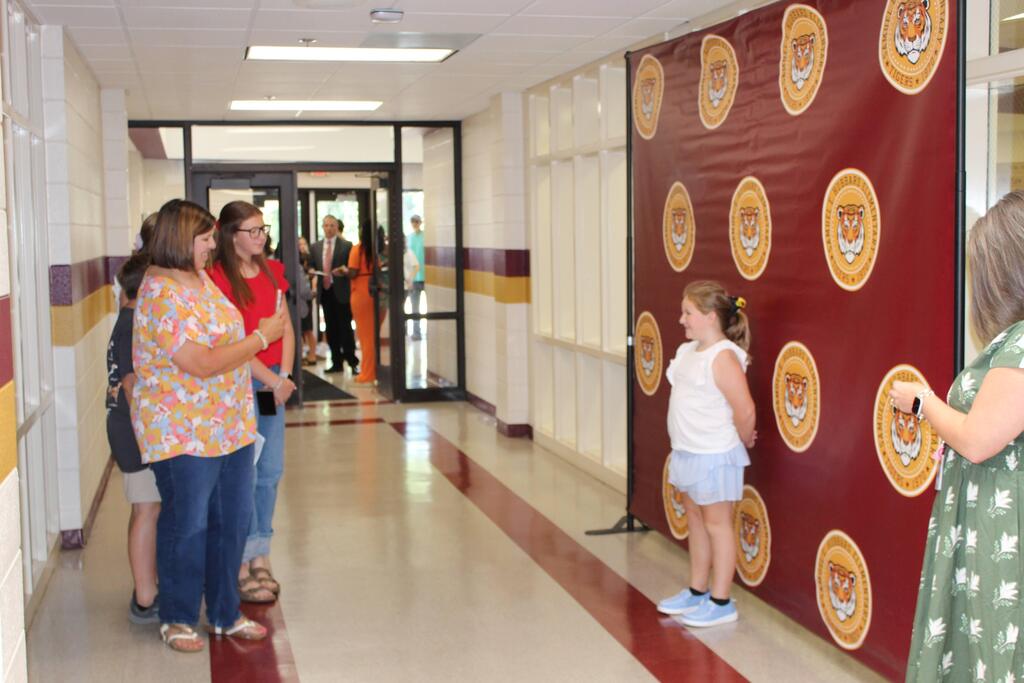 Family taking pictures at Open House