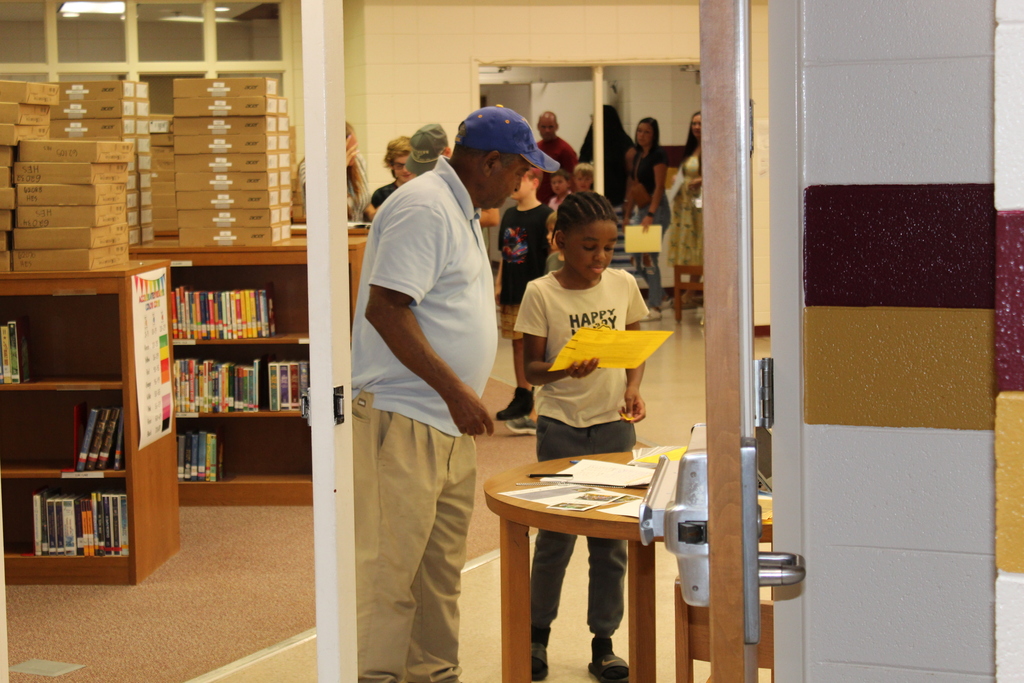 Parents completing forms. 