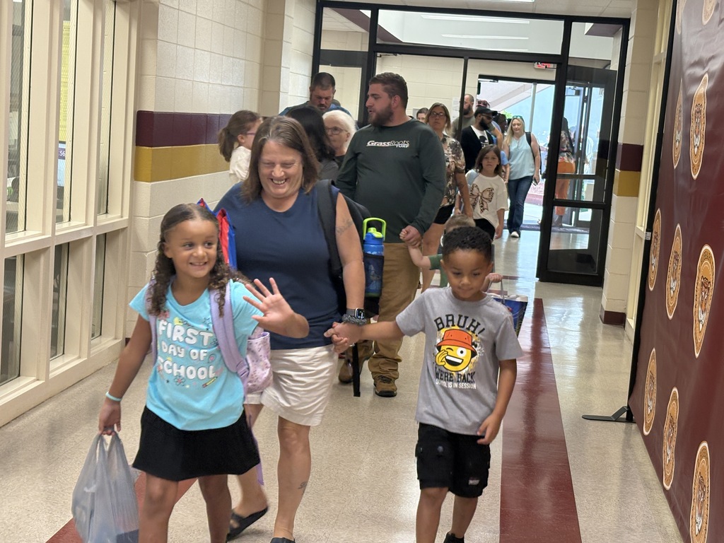 Parents walking students into the first day of school
