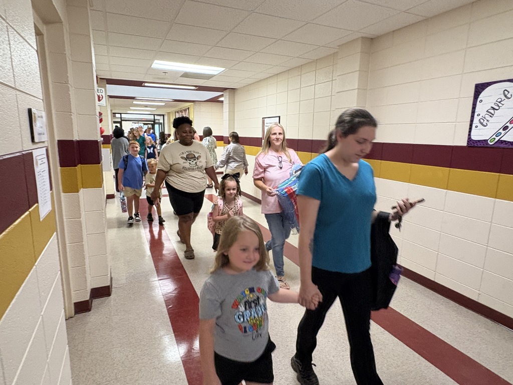 Parents walking students into the first day of school