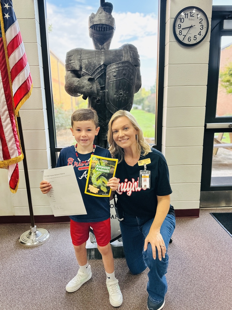 A student receives the first positive behavior reward for the school year.