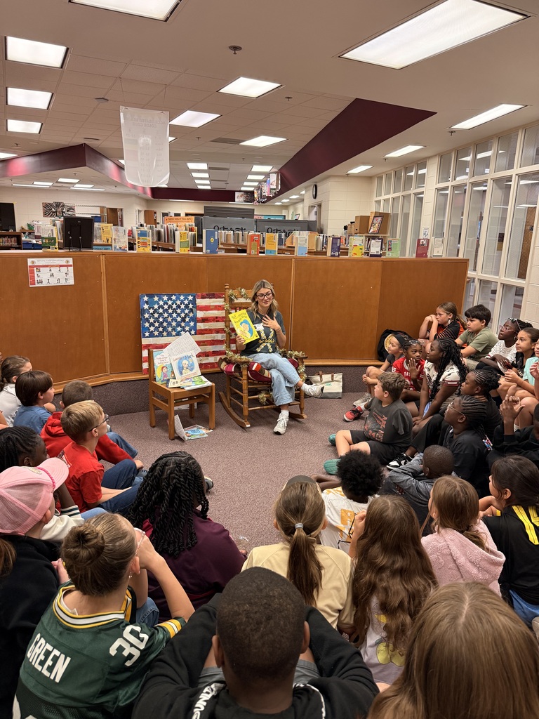 Kylie reading to classes. 