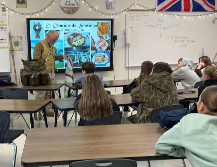 Dr. Womack speaking to students about his journey from France to Spain.