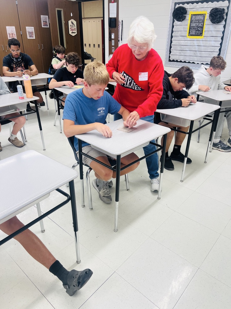 PMS students read The Coffin Quilt and learned to sew. 
