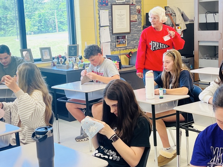 PMS students read The Coffin Quilt and learned to sew. 