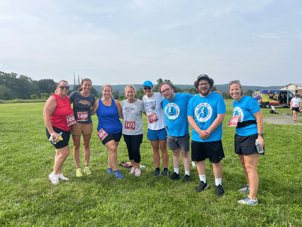 8 people standing together at the Race for ACCE