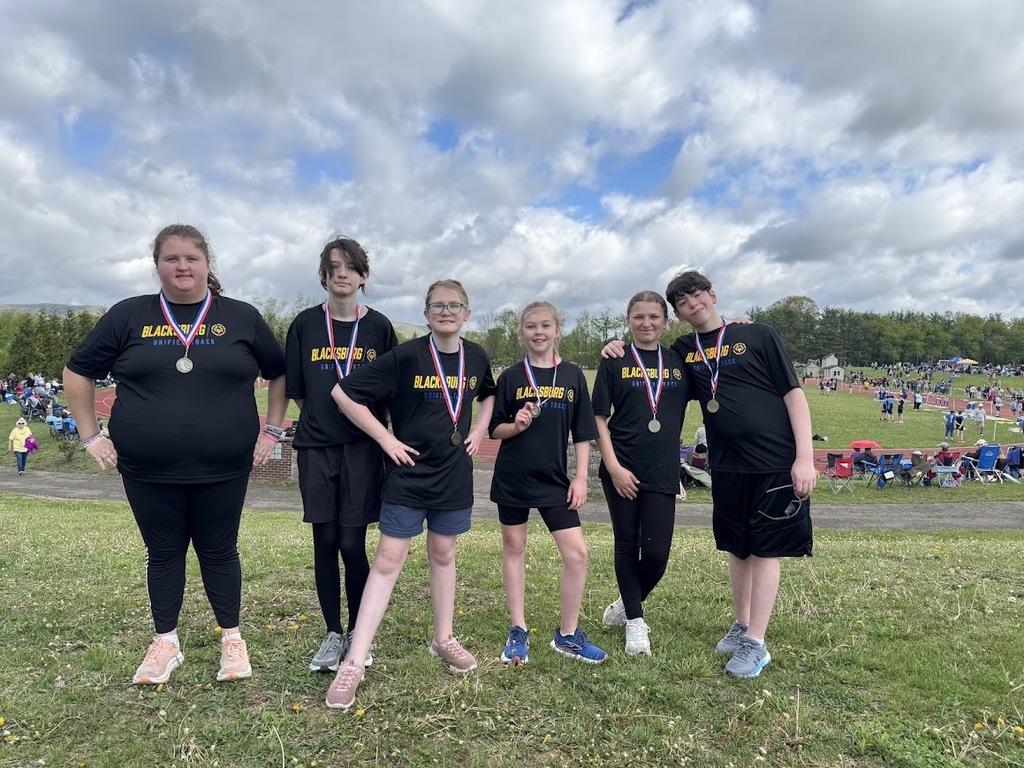 six unified track athletes from BMS standing with medals