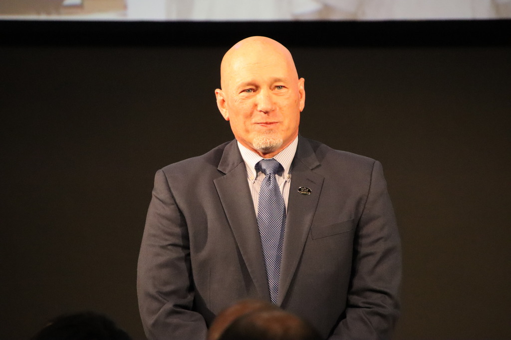 Man smiling at retirement dinner