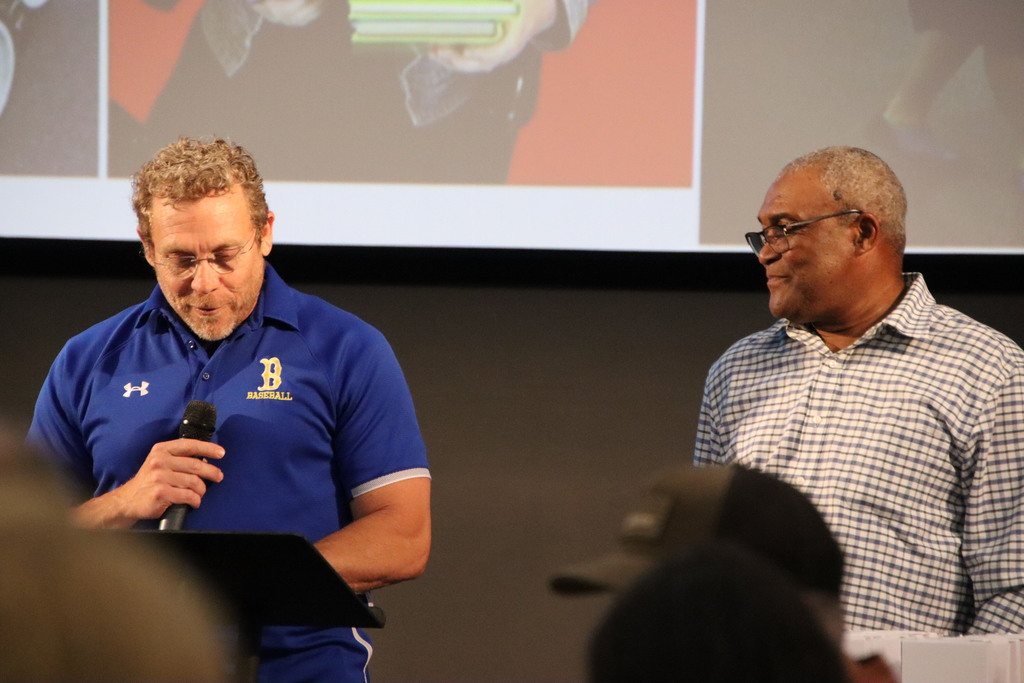 Man talking about retiree at retirement dinner