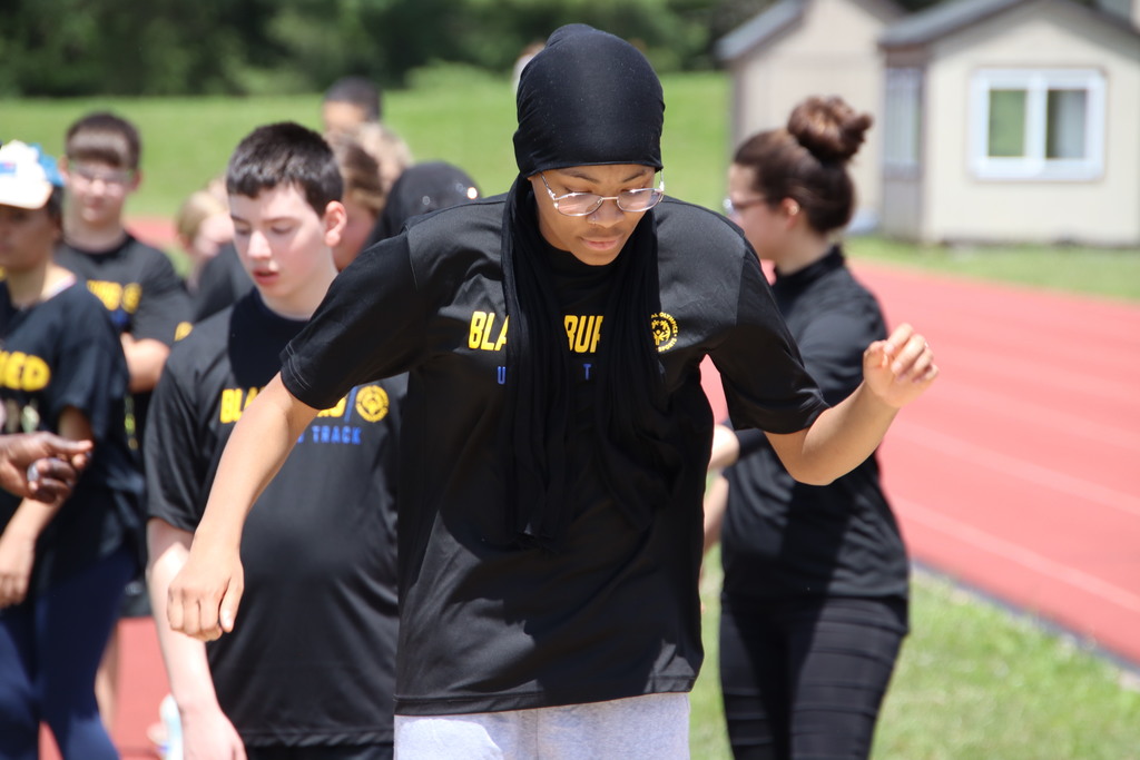 Unified track athlete competing in the long jump