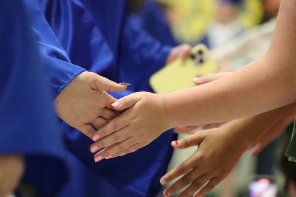 Two students high fiving